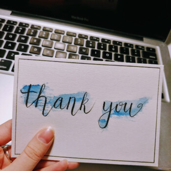 Watercolour, Tombow calligraphy pen. picture of a thank you card with watercolour splashing in the background