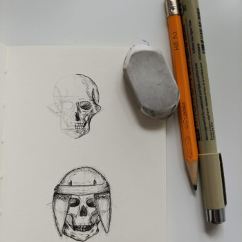 Micron pen, pencil, following a tutorial online. picture of a skeleton sketch, with a pen, pencil, and eraser beside it