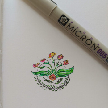 Micron pen, pencil crayons, coloured pens. picture of a drawing of a flower wreath